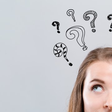 reimage features system optimizers woman wondering question mark symbols above her head gray background